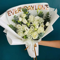 White Serenity” – White Roses, Lisianthuses, Baby’s Breath, and Eucalyptus